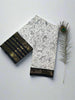 White Kalamkari Saree with Black Zari Border & Intricate Motifs